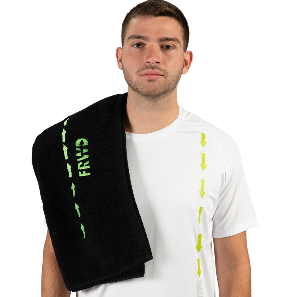 Man holding a black towel with green text on a white background