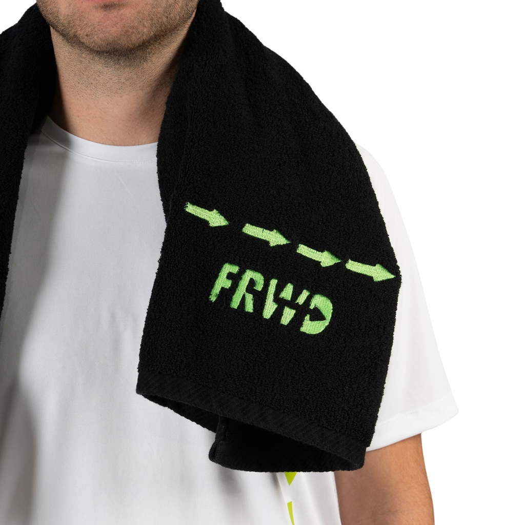 Person wearing a black towel with green 'FRWD' text and arrows on a white background